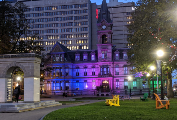 Another angle of Halifax City Hall bathed in purple and blue light.