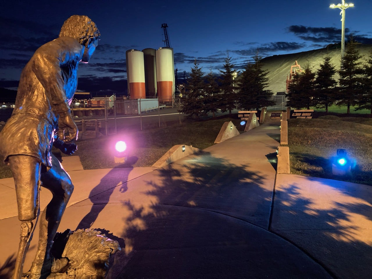 Purple and blue spotlights shining on the Terry Fox Memorial in St. John's
