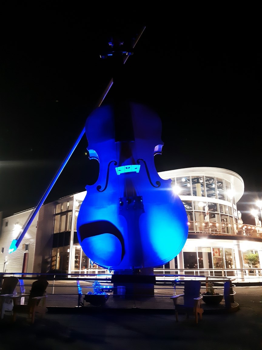 The Big Fiddle in Sydney Nova Scotia is the world's laregest fiddle. It was lit purple and blue for Light It Up! for NDEAM.